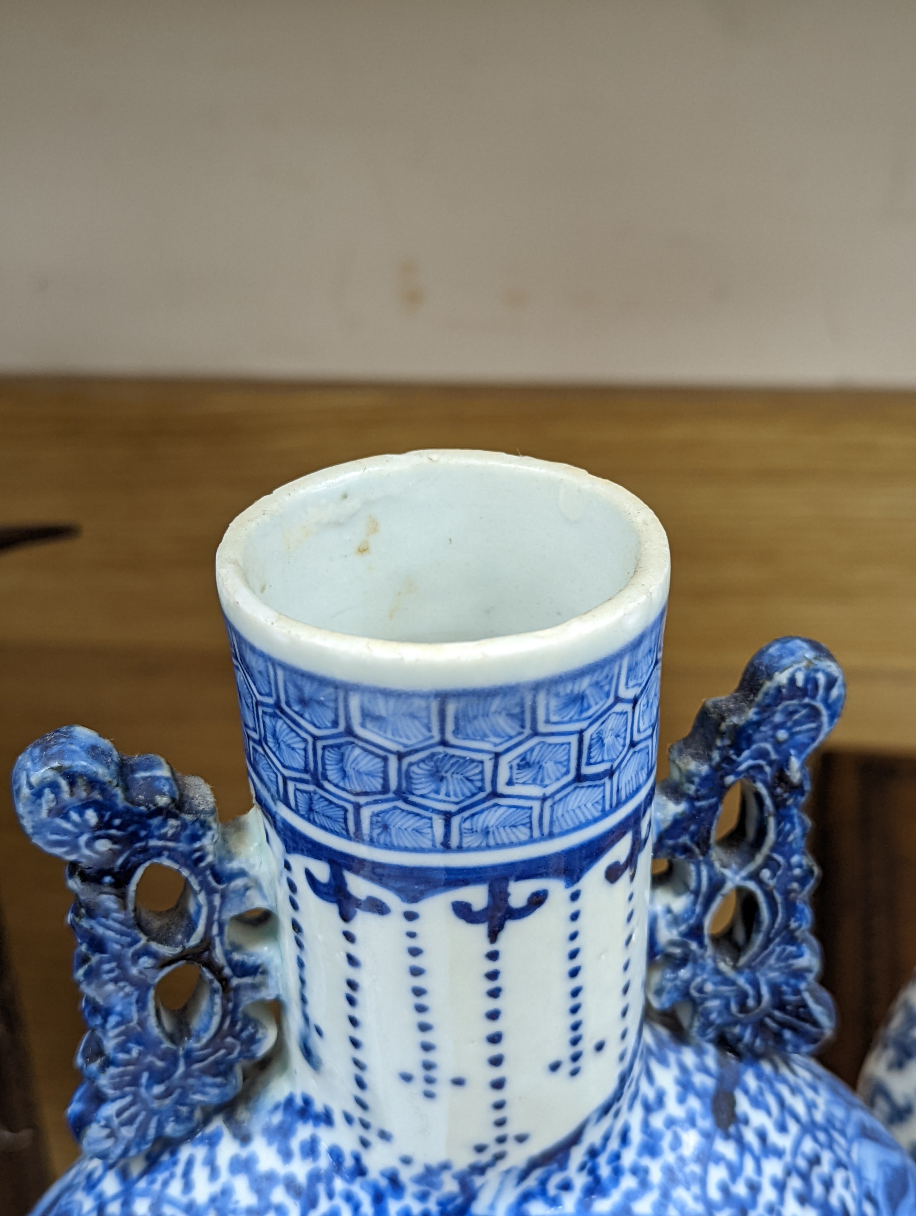 Three 19th century Chinese blue and white Moon flasks, tallest 31 cms.
